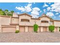 Exterior view of condos featuring garages and balconies at 2050 W Warm Springs Rd # 312, Henderson, NV 89014
