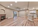 Spacious living room featuring a fireplace, patio access, and modern flooring at 2050 W Warm Springs Rd # 312, Henderson, NV 89014