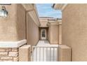 View of the gated front entrance with a path leading to the front door at 2056 Bay Thrush Way, North Las Vegas, NV 89084