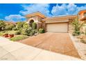 Home featuring a spacious two-car garage and a stamped concrete driveway at 213 Villa Borghese St, Las Vegas, NV 89138