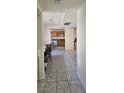 Classic kitchen features wood cabinetry, white appliances, and tile flooring at 236 N Bruce St # C, Las Vegas, NV 89101