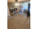 Neutral-toned living room featuring tile floors and bar stool seating at 236 N Bruce St # C, Las Vegas, NV 89101