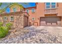 Two-story home boasts a brick driveway leading to two garages at 2497 Birch Hollow St, Henderson, NV 89044