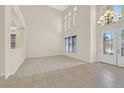 Spacious foyer with high ceilings and a decorative chandelier at 2753 Kildrummie St, Henderson, NV 89044
