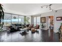 Bright, open living room with floor-to-ceiling windows and comfortable seating at 322 Karen Ave # 601, Las Vegas, NV 89109