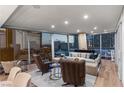 Comfortable living room with stylish furnishings, hardwood floors and expansive city views at 3726 Las Vegas Blvd # 606, Las Vegas, NV 89158