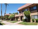 Exterior shot of townhomes with desert landscaping and a terra cotta tile roof at 4310 Lynnann Dr, Las Vegas, NV 89110