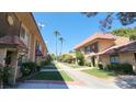 Street view of townhomes with desert landscaping on front lawns at 4310 Lynnann Dr, Las Vegas, NV 89110