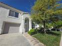 Charming home featuring a well-maintained front lawn and attached garage at 451 Rumford Pl, Henderson, NV 89074