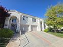 Beautiful home exterior with multi-car garage and inviting front entrance at 451 Rumford Pl, Henderson, NV 89074