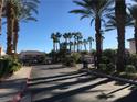 Community entrance featuring palm trees and well-maintained landscaping at 4555 E Sahara Ave # 226, Las Vegas, NV 89104