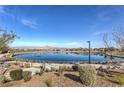 Beautiful community pond with manicured landscaping and walking paths at 508 Cadence View Way, Henderson, NV 89011