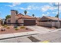 Single-story house featuring a two-car garage and xeriscape front yard at 5725 Cedar Ave, Las Vegas, NV 89110