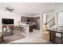 Bright living space with barstool seating, stainless appliances, and an adjacent dining area at 620 Bellus Pl # Lot 168, Henderson, NV 89015
