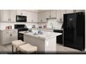 Well-equipped kitchen featuring stainless steel appliances, granite countertops, and an island with seating at 624 Bellus Pl # Lot 170, Henderson, NV 89015