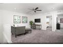 Cozy loft area with comfortable seating, a ceiling fan, and access to other rooms in the house at 624 Bellus Pl # Lot 170, Henderson, NV 89015