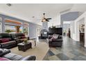 Spacious living room with a fireplace, high ceilings, and views of the backyard at 7511 Bridlehorne Ave, Las Vegas, NV 89131