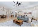 Open floor plan featuring a spacious living room and kitchen with modern appliances and a large island at 81 Alerion St, Las Vegas, NV 89138