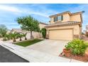 Lovely two-story home features desert landscaping, a two-car garage, and a private driveway at 8221 Stoneheather Ct, Las Vegas, NV 89117