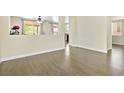 Open-concept living room with hardwood floors and ample natural light at 8221 Stoneheather Ct, Las Vegas, NV 89117