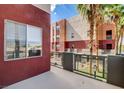 A cozy balcony perfect for relaxing with a view of the building exterior at 83 E Agate Ave # 207, Las Vegas, NV 89123
