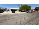 Quaint single-story home featuring a white exterior, covered entryway, and well-kept yard at , Las Vegas, NV 89110