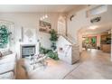 Bright living room with a fireplace, high ceilings, and stairs leading to the second floor at 1742 Ashburn Dr, North Las Vegas, NV 89032