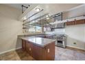 Modern kitchen with granite countertops, stainless steel appliances, and ample storage space at 1929 Stonington Pl, Las Vegas, NV 89108