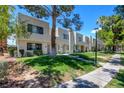 A lovely outdoor space showcasing well-maintained lawns and shade trees at 2696 Matogroso Ln, Las Vegas, NV 89121