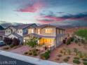 Charming two-story home with manicured landscaping under a beautiful sky at 2832 Aragon Terrace Way, Henderson, NV 89044