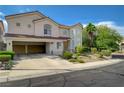 Beautiful two-story home featuring a three-car garage, well-maintained landscaping, and mature trees at 3192 Tullio Way, Henderson, NV 89052