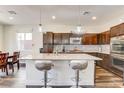 Bright kitchen featuring granite countertops, stainless steel appliances and stylish barstool seating at 3839 Zodiacal Light St, Las Vegas, NV 89129