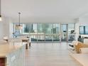 Open-concept condo featuring a dining area, a stylish living room with expansive windows with city views at 4471 Dean Martin Dr # 1109, Las Vegas, NV 89103