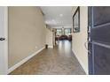 Inviting foyer with tile flooring leading to the dining and living areas at 4630 Summer Azure St, North Las Vegas, NV 89031