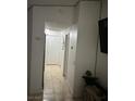 Interior hallway features tile floors and white walls at 5353 Hollow Brook Ave, Las Vegas, NV 89142