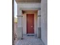 Close-up of the front door with sidelight and decorative brick columns and trim at 5712 French Lace Ct, North Las Vegas, NV 89081