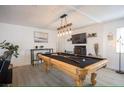 Game room boasts a beautifully decorated pool table and updated lighting at 6432 Bannock Way, Las Vegas, NV 89107