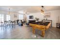 Open living space with pool table, dining area, and ample natural light at 6432 Bannock Way, Las Vegas, NV 89107