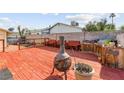 A spacious deck with seating area features a charming fire pit perfect for outdoor entertaining and relaxation at 6612 Elton Ave, Las Vegas, NV 89107