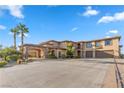 Beautiful home with grand driveway, desert landscaping, porte-cochere, and a three-car garage at 670 Du Fort Ave, Henderson, NV 89002