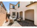 Private outdoor patio featuring brick flooring, comfortable seating, and a covered area at 7194 Sage Wren Ct, Las Vegas, NV 89148