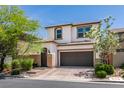 Charming two-story home with a neatly landscaped front yard and two-car garage at 7194 Sage Wren Ct, Las Vegas, NV 89148