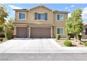 Attractive two-story home with a three-car garage and manicured front yard at 8084 Bosco Bay Ave, Las Vegas, NV 89113