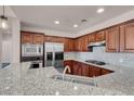 Stylish kitchen featuring granite countertops and stainless steel appliances at 87 E Agate Ave # 403, Las Vegas, NV 89123
