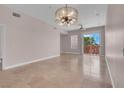 Bright, open living room with sliding glass doors to a balcony at 87 E Agate Ave # 403, Las Vegas, NV 89123