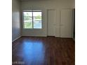 Bedroom with wood floor, two doors and bright window at 9000 Las Vegas Blvd # 2189, Las Vegas, NV 89123