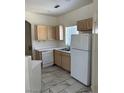 Kitchen features light wood cabinets, white appliances, and a window for natural light at 9000 Las Vegas Blvd # 2189, Las Vegas, NV 89123