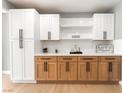 Kitchen with white and wood cabinets, stainless steel appliances, and light countertops at 915 Melrose Dr, Las Vegas, NV 89101