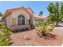Inviting single-story home with a well-maintained front yard and a two-car garage at 110 Eagleview Ct, Henderson, NV 89074