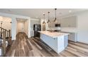 Modern kitchen featuring a large island, stainless steel appliances, and sleek gray cabinetry at 1213 Granite Falls Pl, North Las Vegas, NV 89084